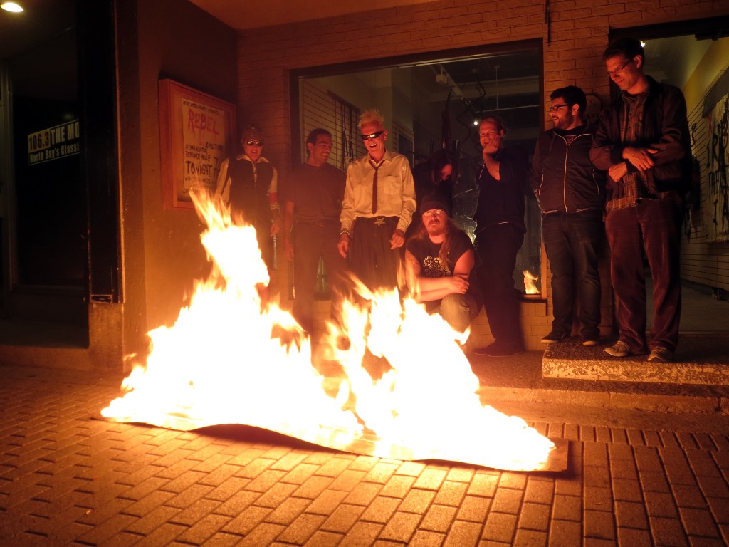 Istvan Kantor lighting things on fire as part of his REBEL performance at White Water Gallery